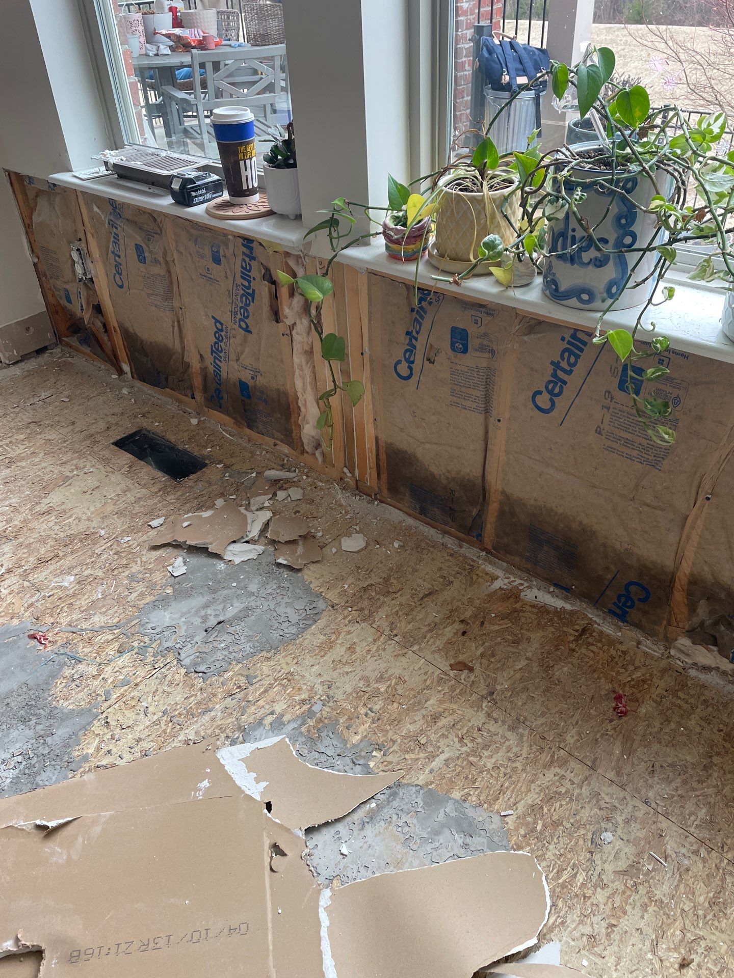 Damaged wall insulation and subfloor after storm damage in Steubenville