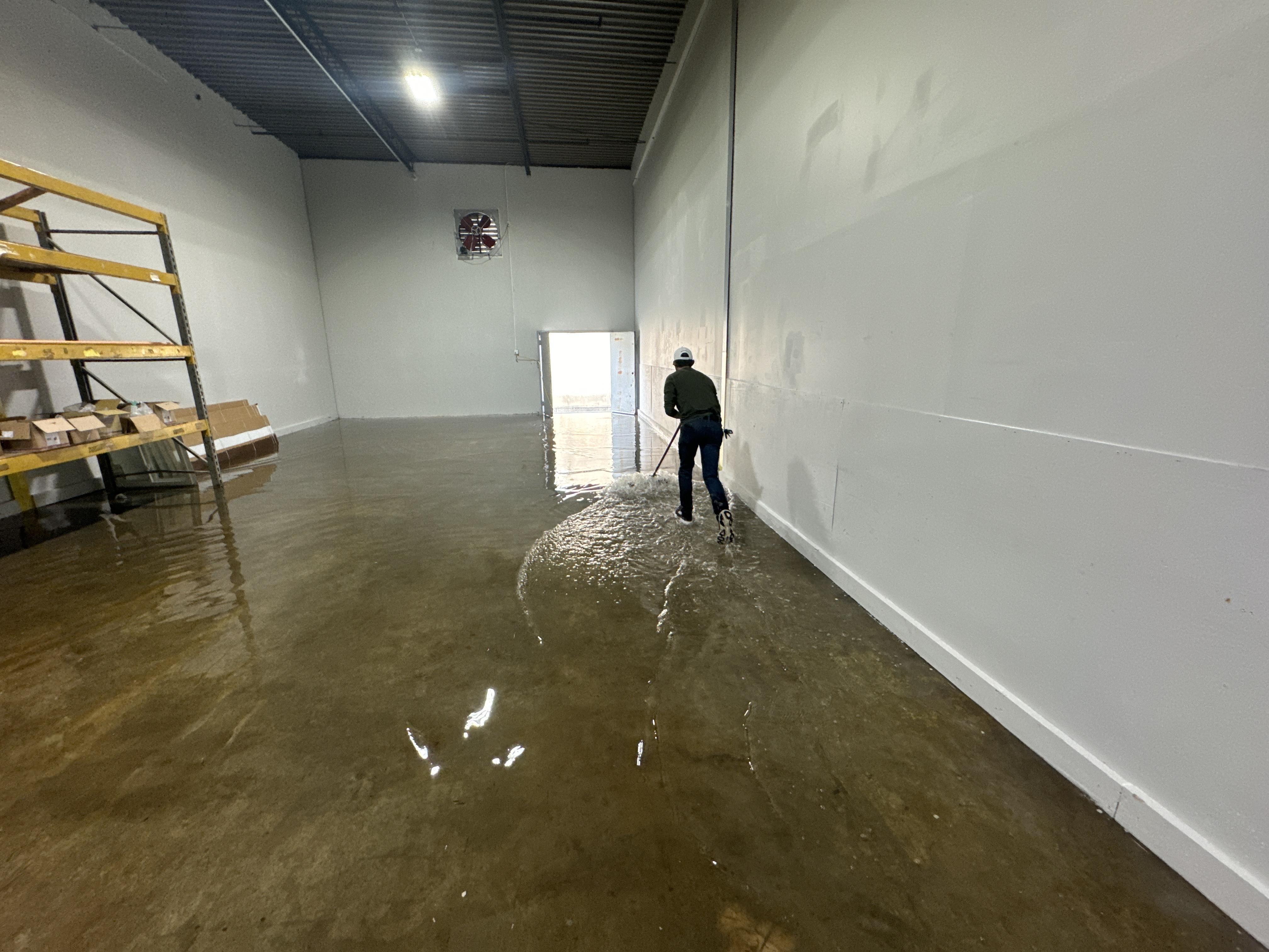 IRS crew member extracting standing water from a Steubenville commercial building
