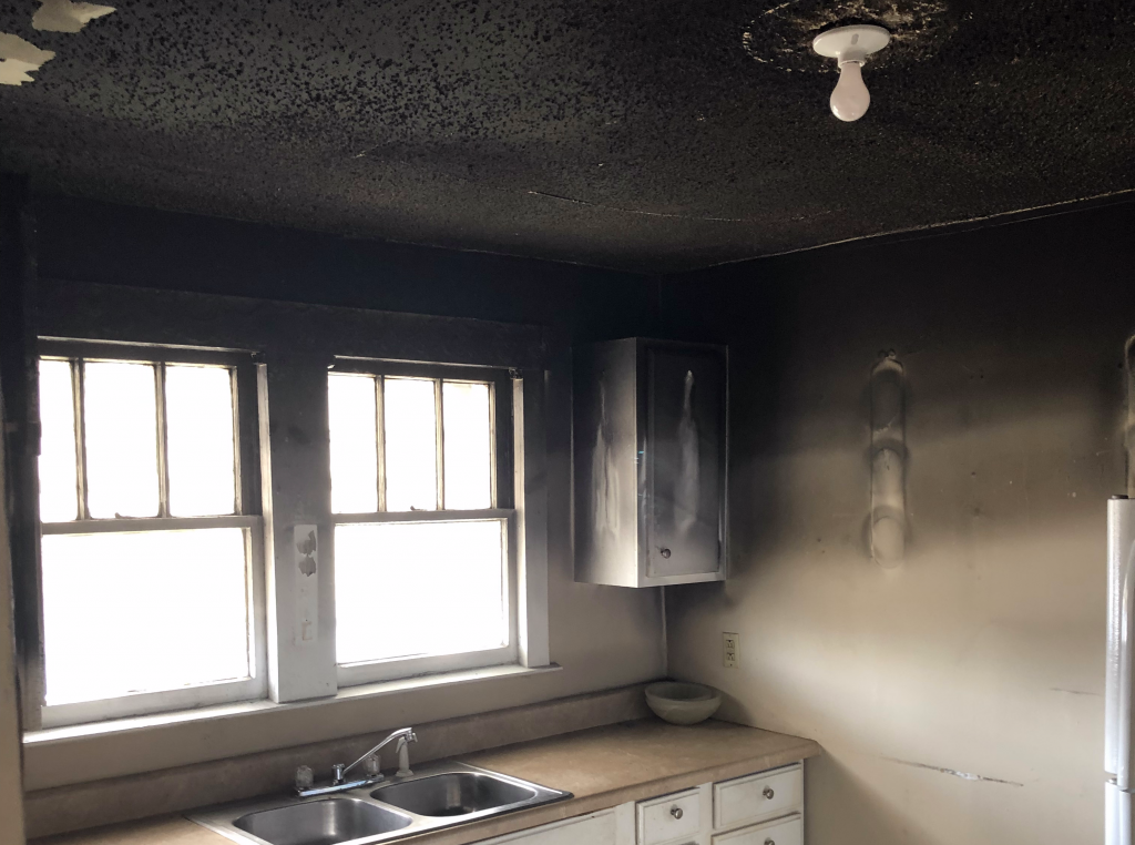 Heavy smoke and soot damage in a Steubenville kitchen after a fire